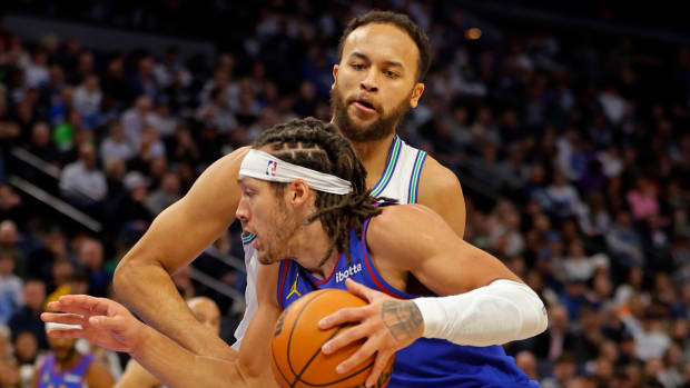 Denver Nuggets forward Aaron Gordon (50) works around Minnesota Timberwolves forward Kyle Anderson (1) in the second quarter at Target Center in Minneapolis on March 19, 2024.